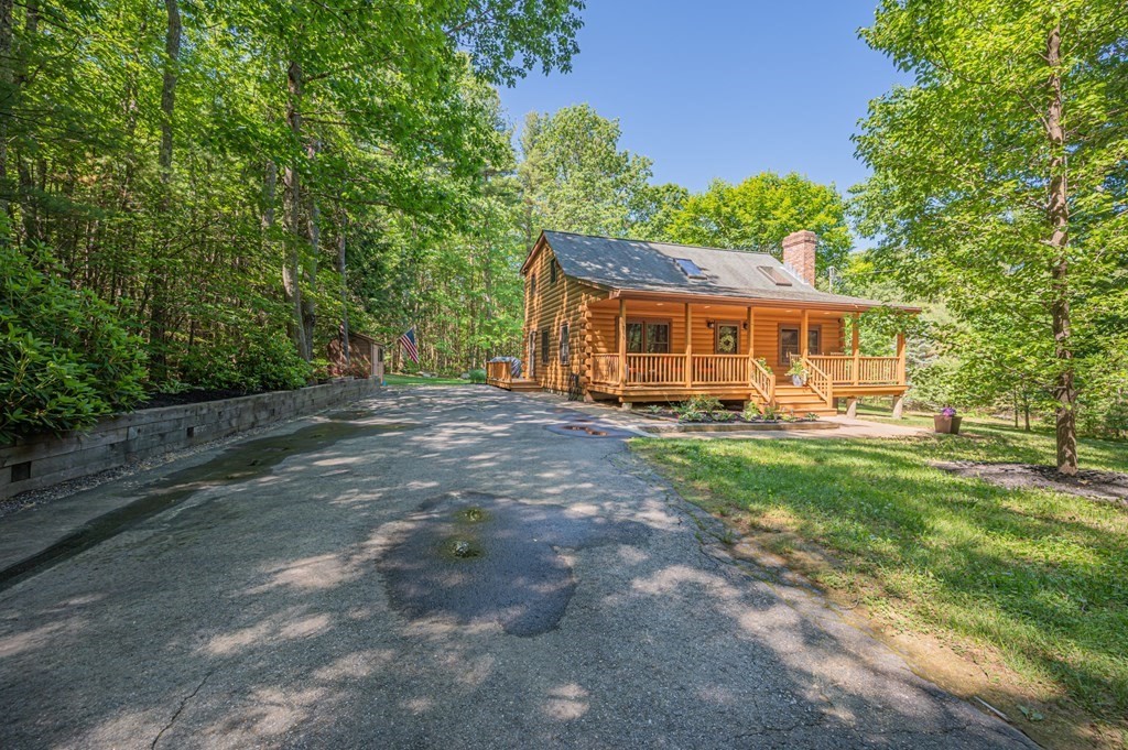 769 Mason Road Holden, MA 01522 - Photo 24 of 29 a view of a house with backyard porch and sitting area