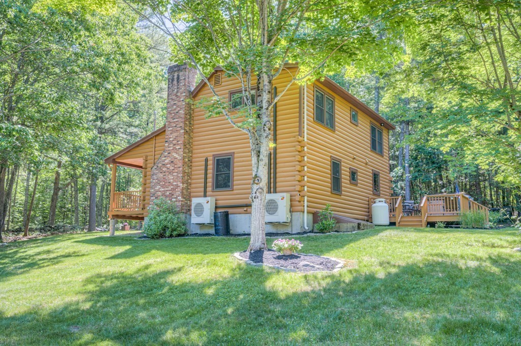 769 Mason Road Holden, MA 01522 - Photo 28 of 29 a view of a house with a yard and sitting area