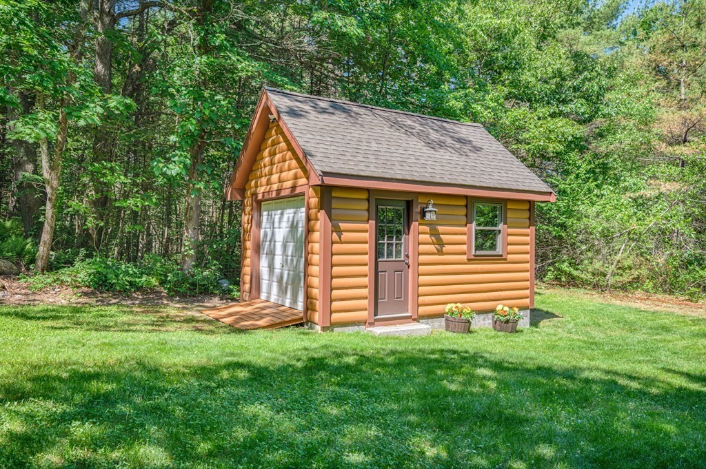 769 Mason Road Holden, MA 01522 - Photo 29 of 29 a backyard of a house with lots of green space