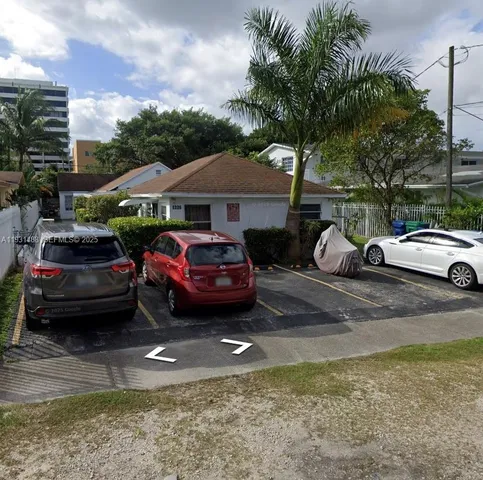 a car parked in front of a house