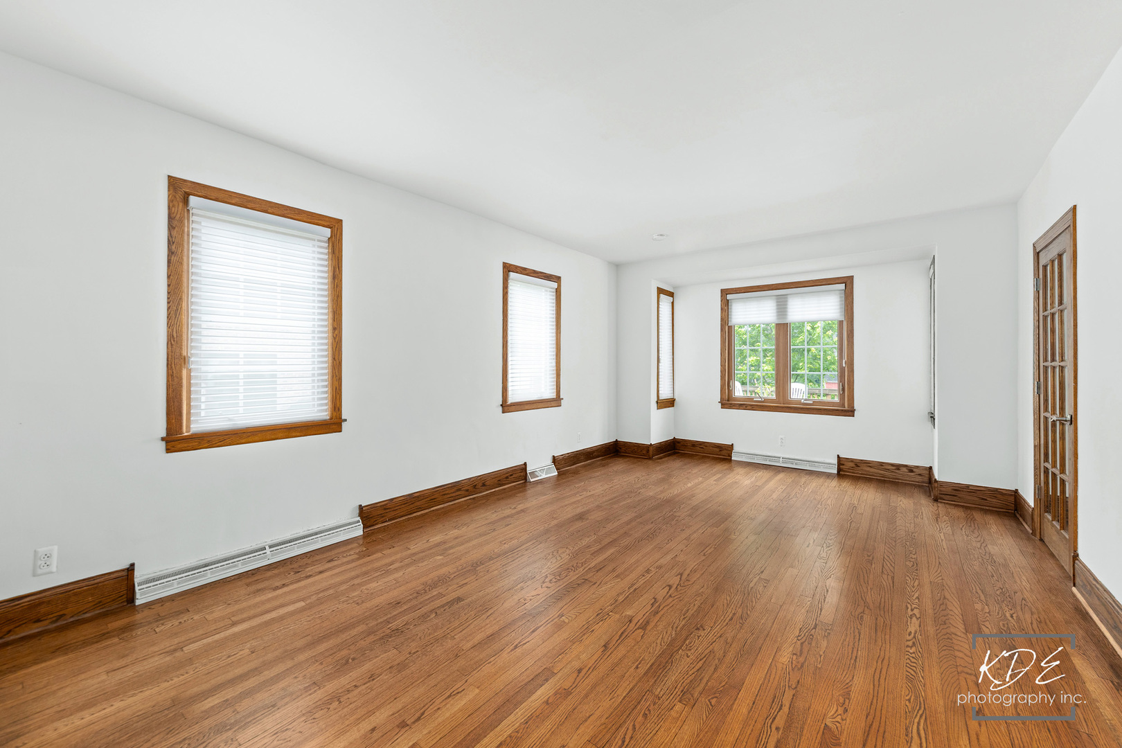 330 South Maple Street Itasca, IL 60143 - Photo 12 of 67 a view of an empty room with wooden floor and a window