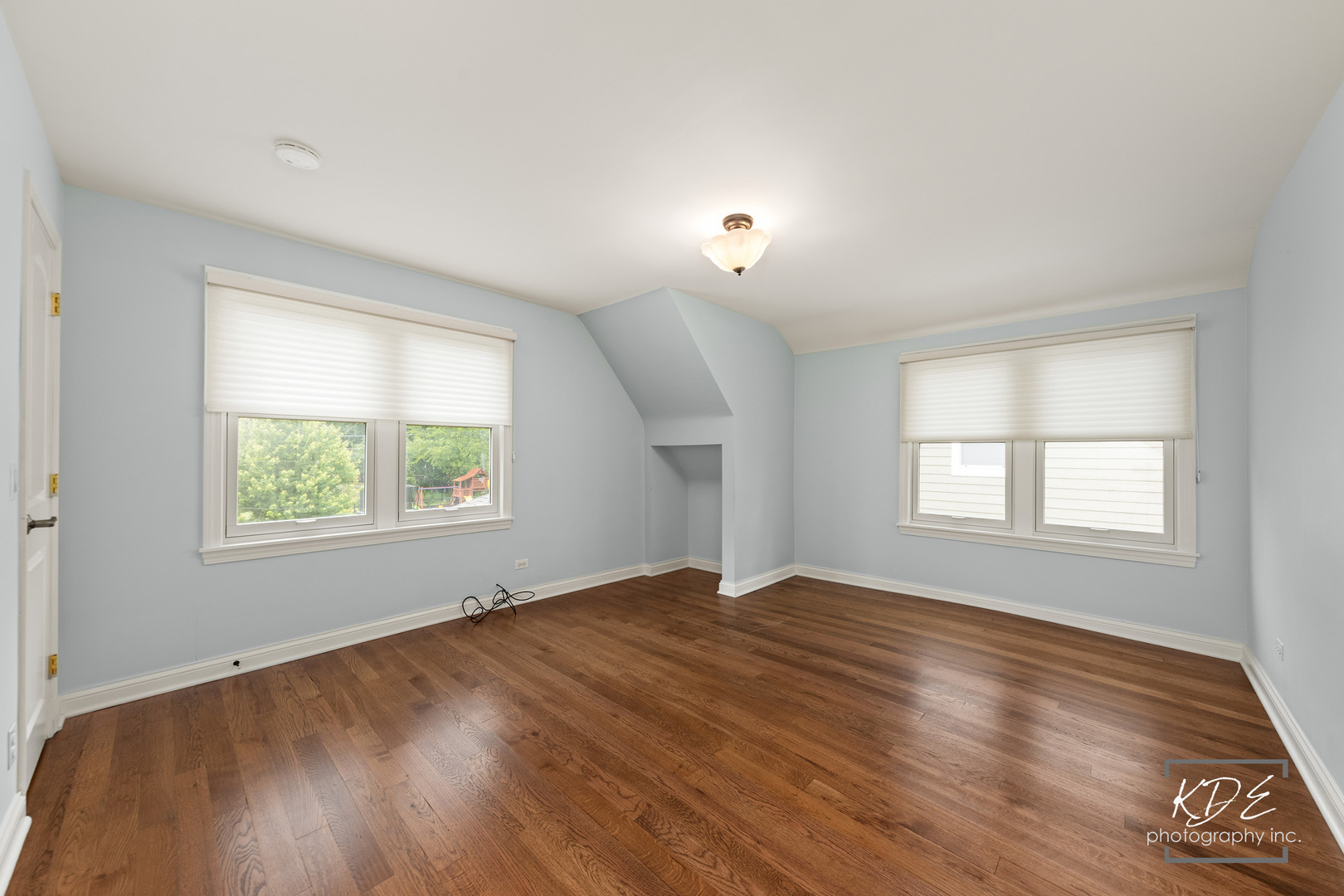 330 South Maple Street Itasca, IL 60143 - Photo 39 of 67 a view of an empty room with wooden floor and a window