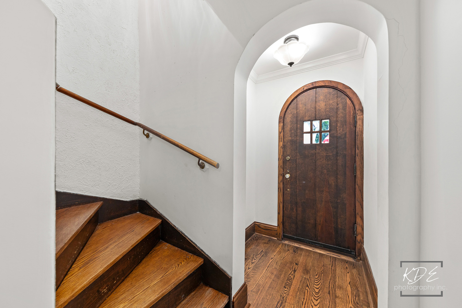 330 South Maple Street Itasca, IL 60143 - Photo 4 of 67 a view of staircase with railing and a potted plant