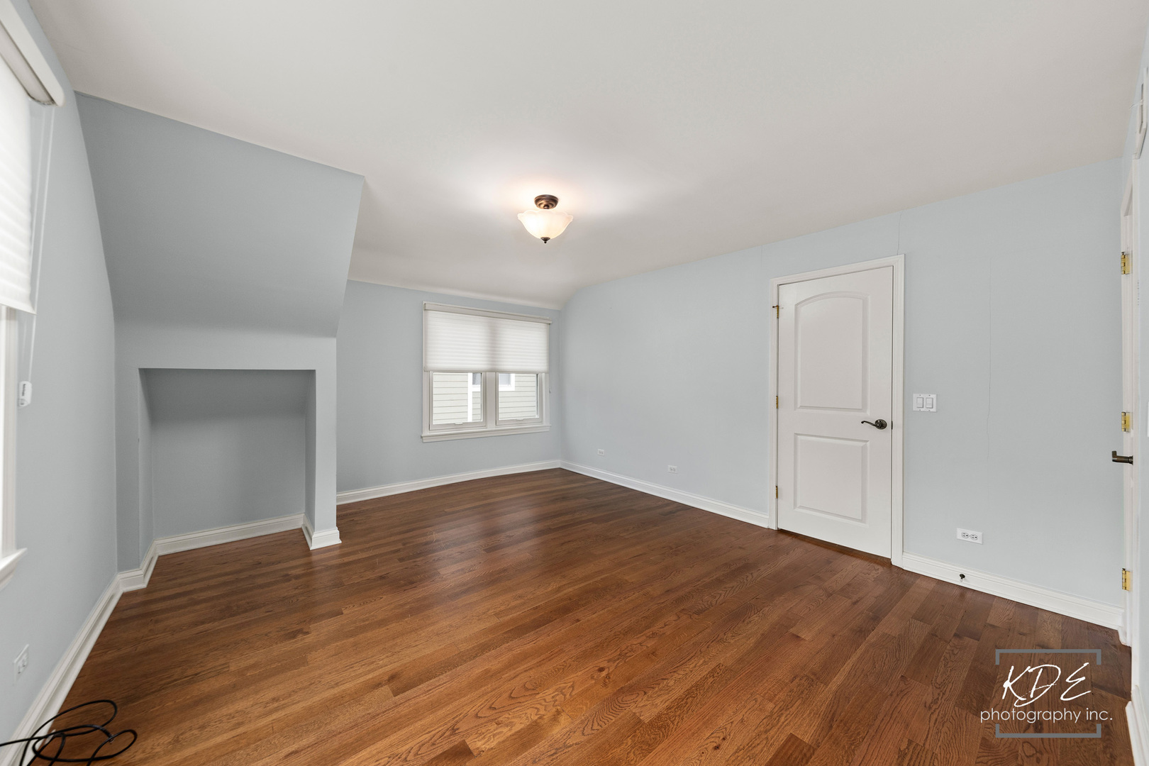 330 South Maple Street Itasca, IL 60143 - Photo 41 of 67 a view of an empty room with window and wooden floor