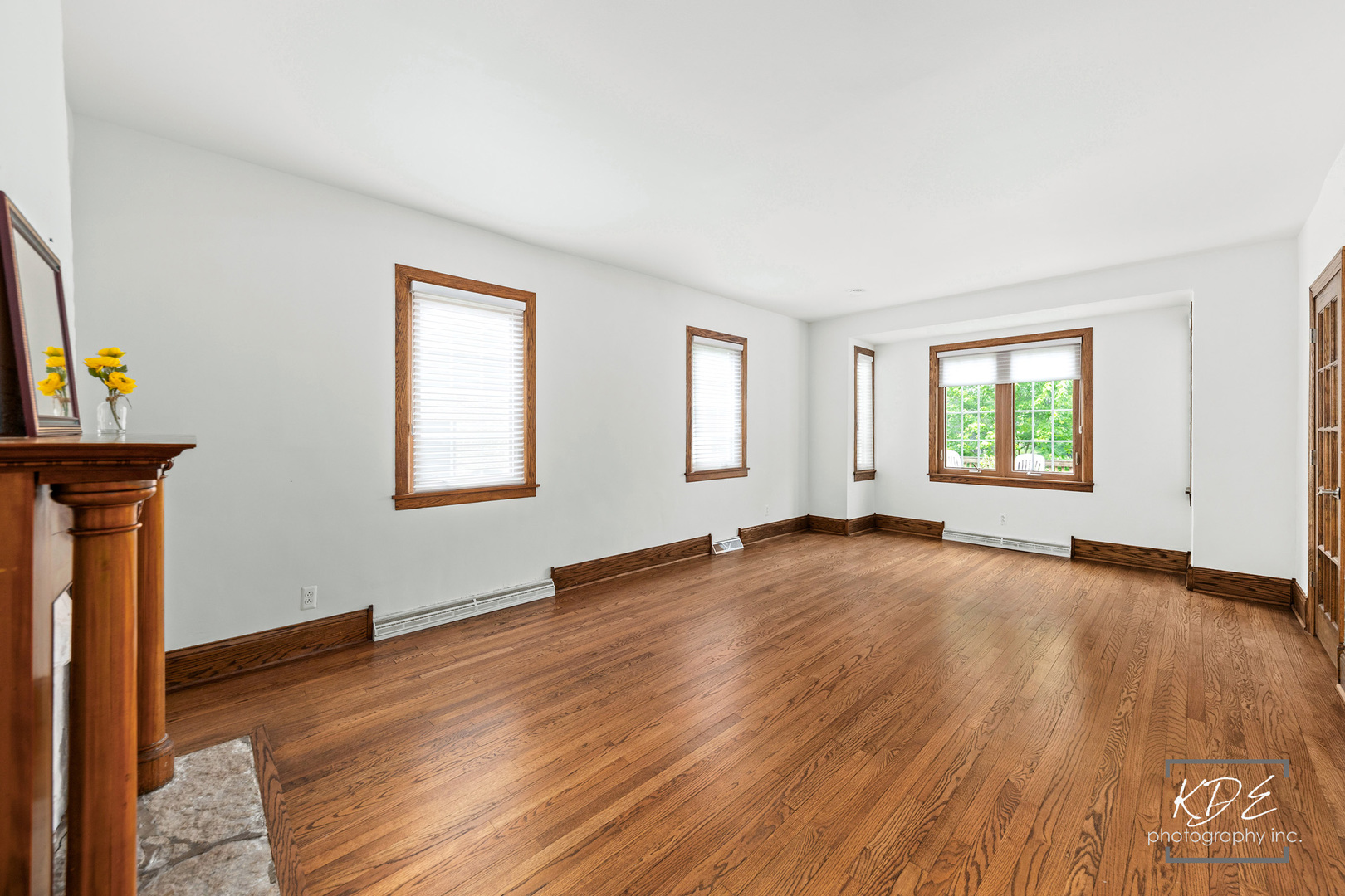 330 South Maple Street Itasca, IL 60143 - Photo 9 of 67 an empty room with wooden floor and windows