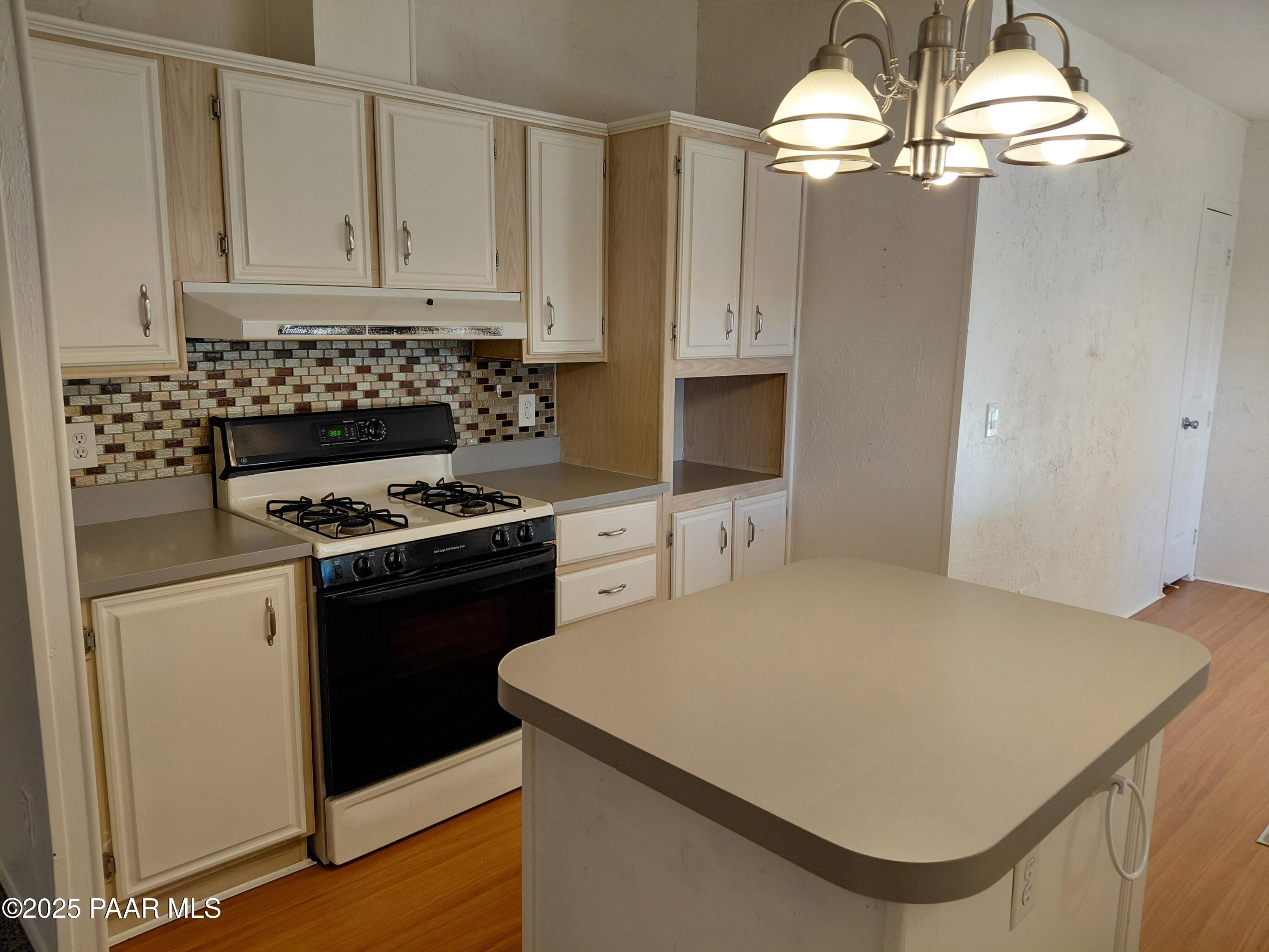 17351 East Bob White Road Mayer, AZ 86333 - Photo 18 of 54 a kitchen with a appliances sink and cabinets