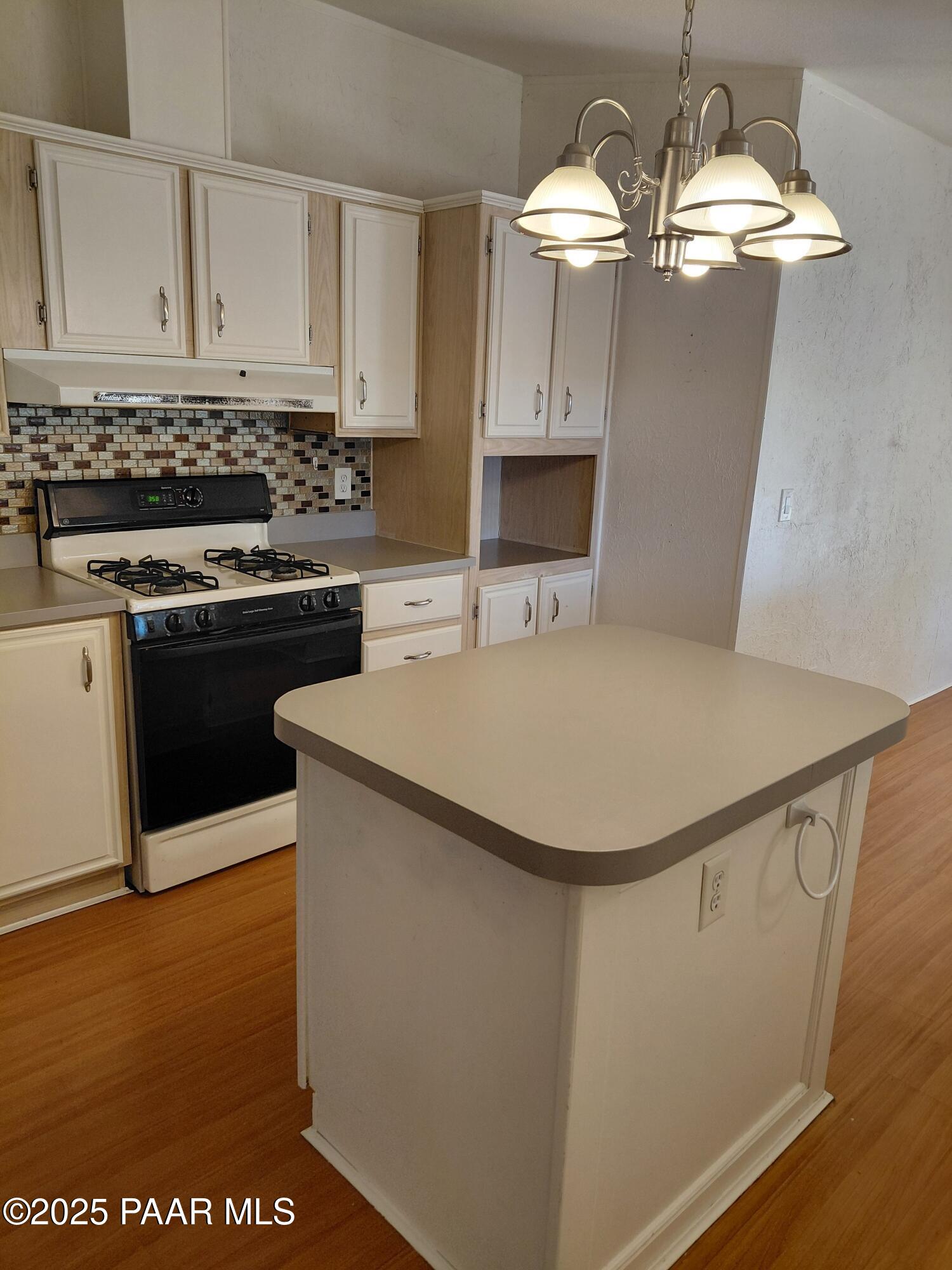 17351 East Bob White Road Mayer, AZ 86333 - Photo 19 of 54 a kitchen with stainless steel appliances granite countertop a sink dishwasher a stove a refrigerator a washer and dryer