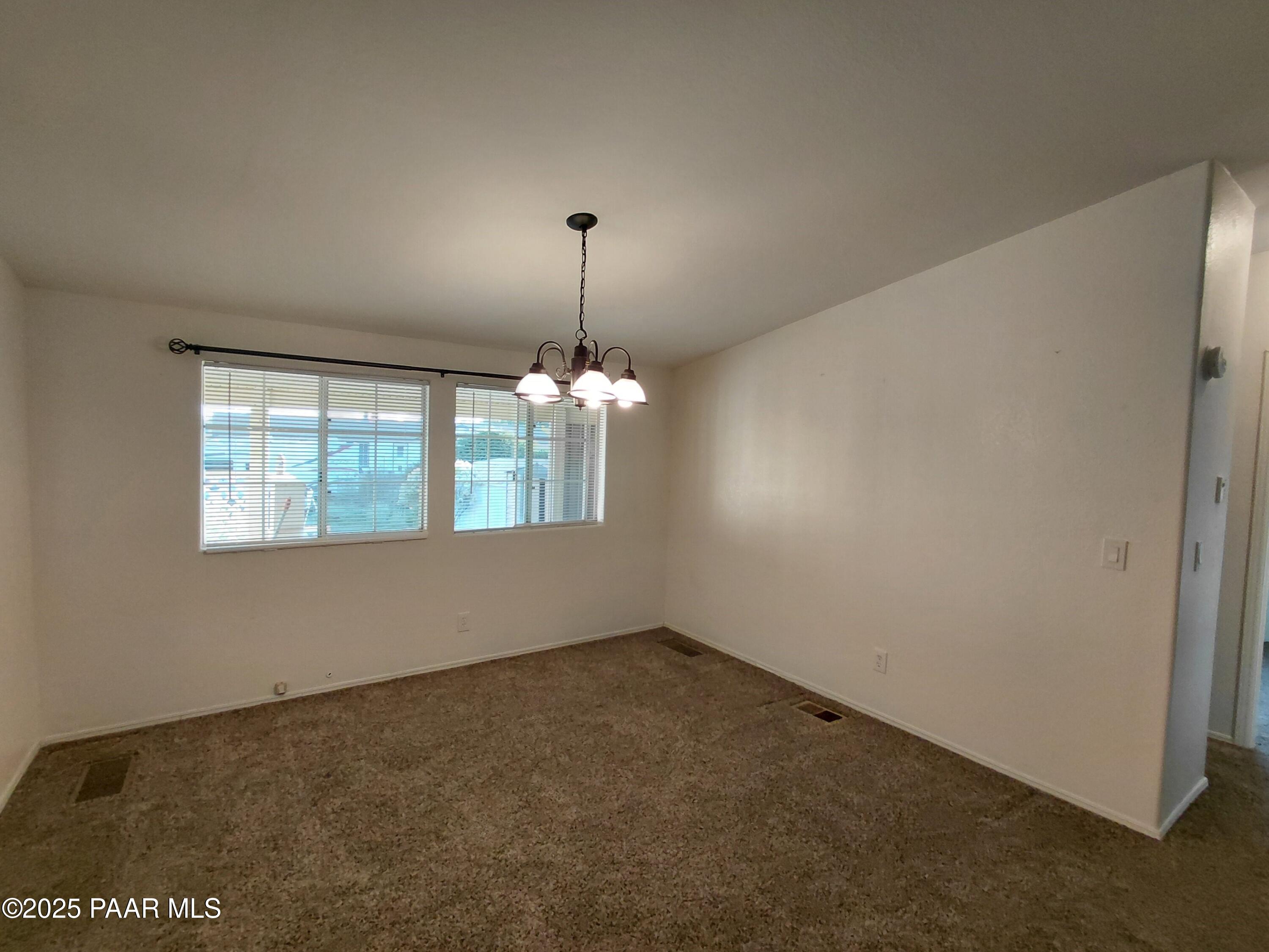 17351 East Bob White Road Mayer, AZ 86333 - Photo 25 of 54 an empty room with windows