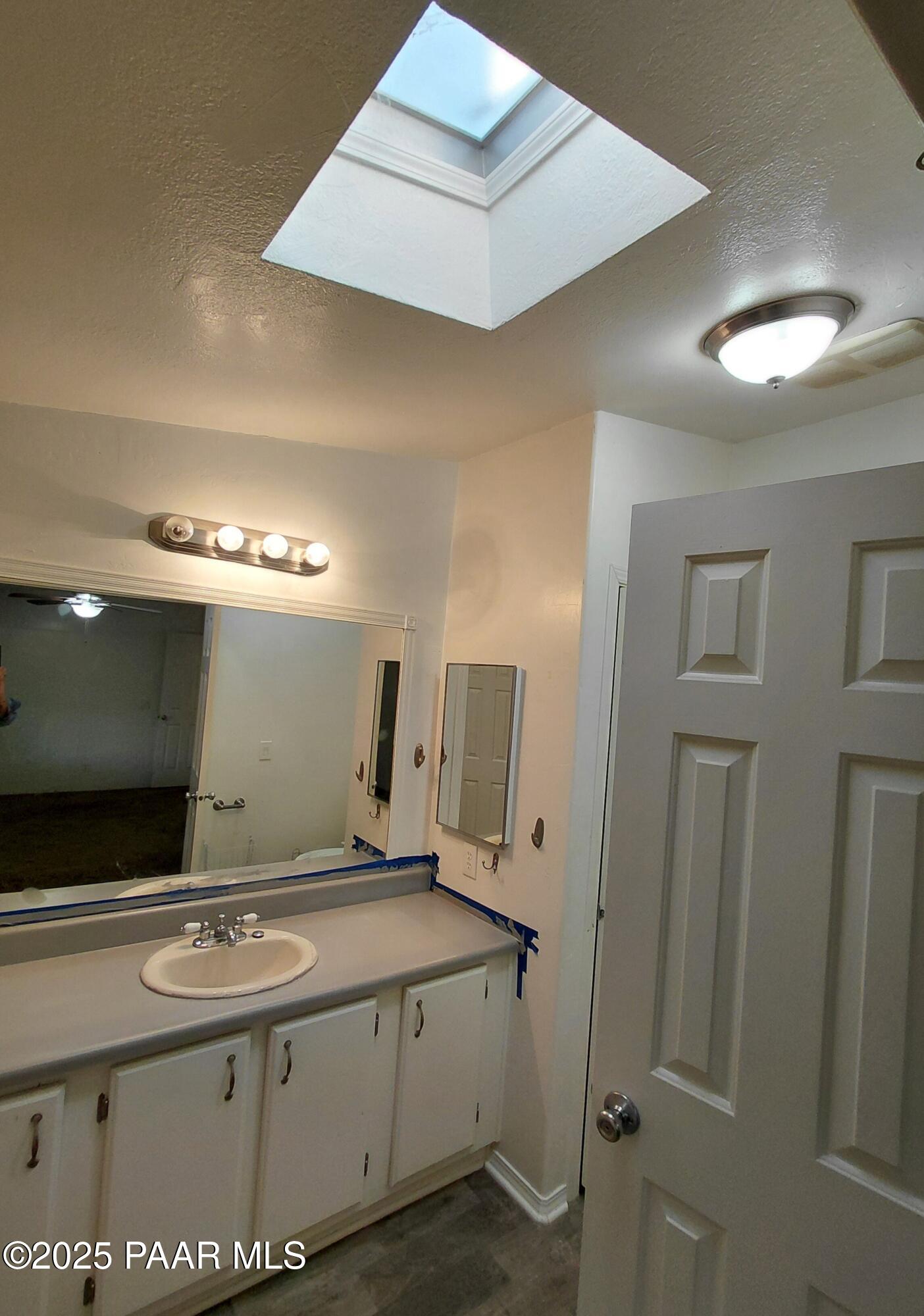 17351 East Bob White Road Mayer, AZ 86333 - Photo 28 of 54 a bathroom with a sink and a mirror