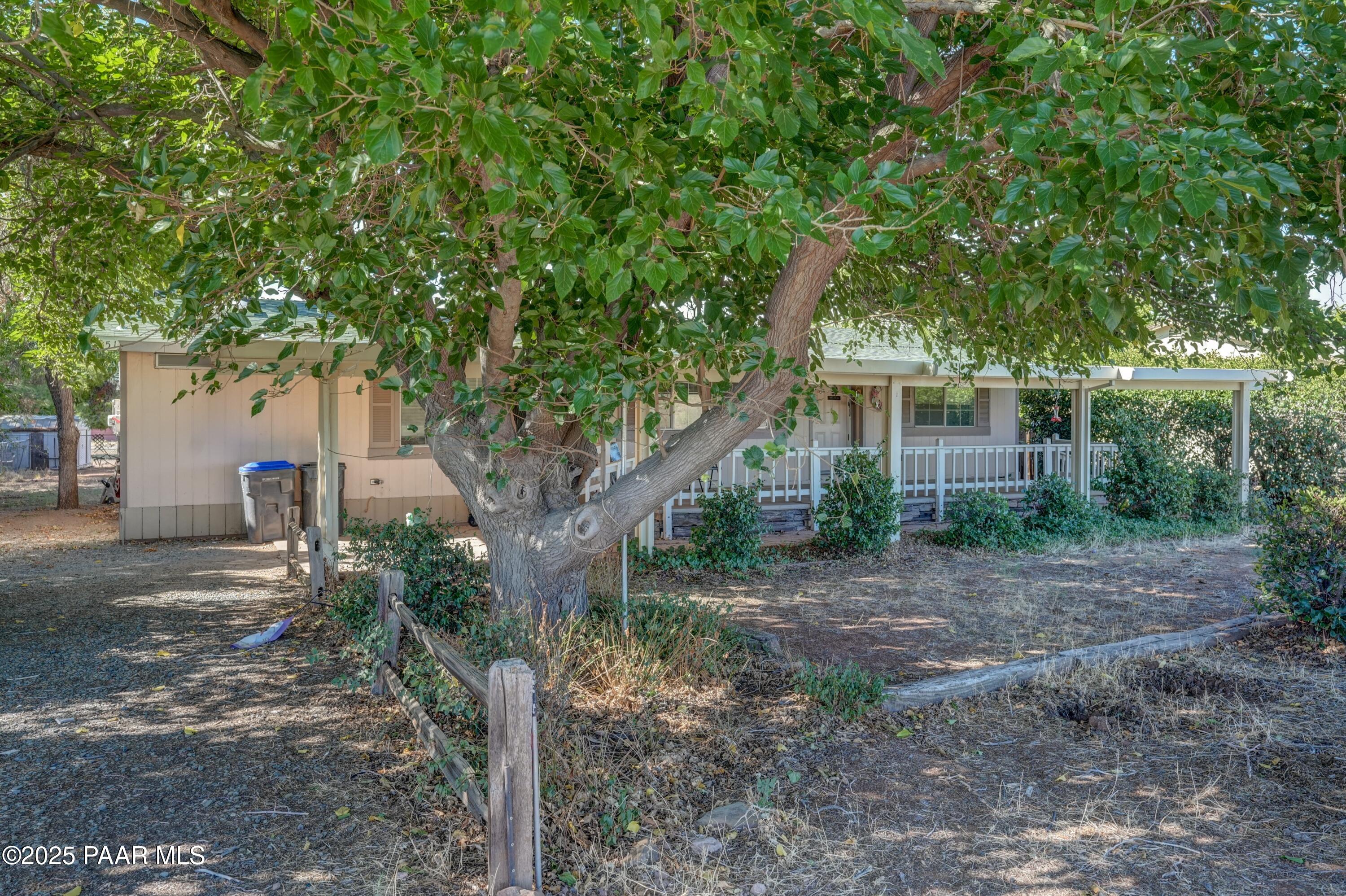 17351 East Bob White Road Mayer, AZ 86333 - Photo 3 of 54 a view of a house with a tree in front of it