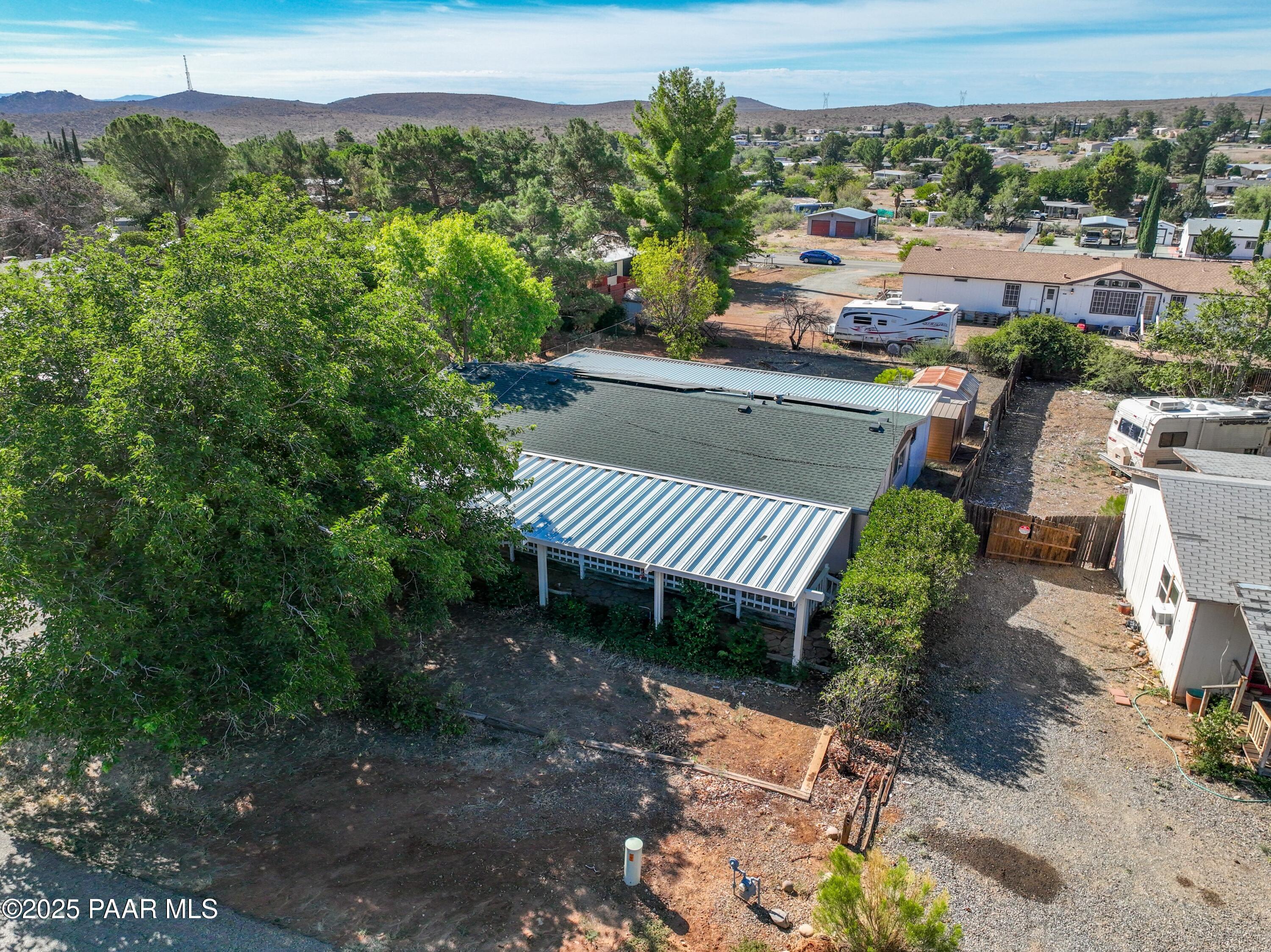17351 East Bob White Road Mayer, AZ 86333 - Photo 8 of 54 a view of a patio with chairs and a flower pot