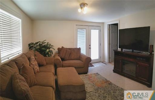 631 Magnolia Road North Brunswick, NJ 08902 - Photo 9 of 20 a living room with furniture and a flat screen tv