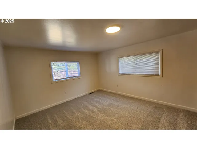 a open hall with a painting on the wall