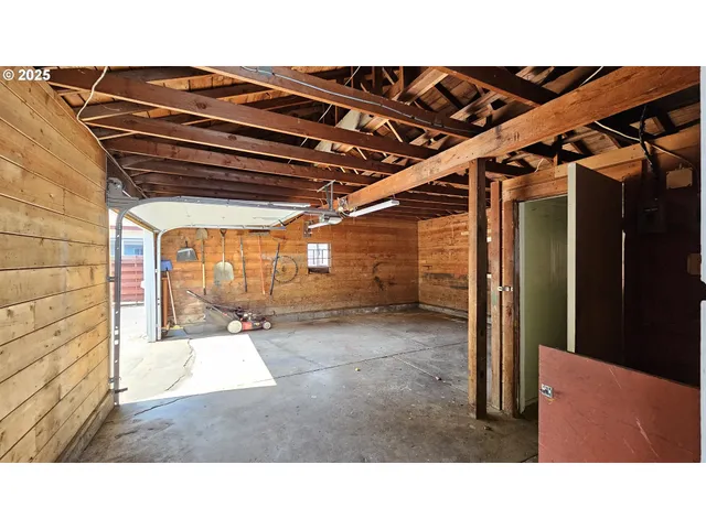 a kitchen with a refrigerator and window