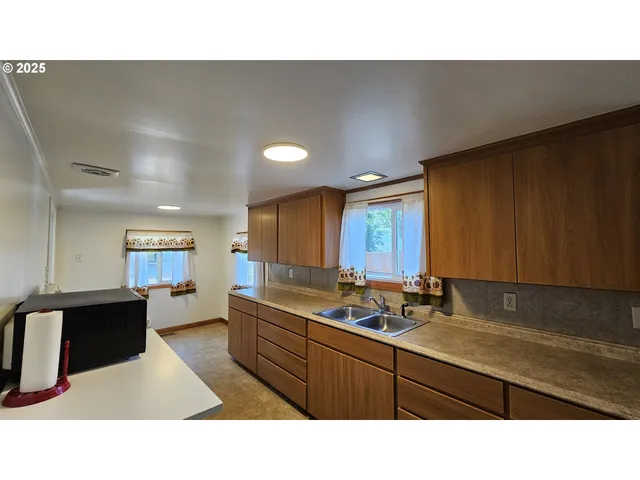 a view of a room with furniture and window