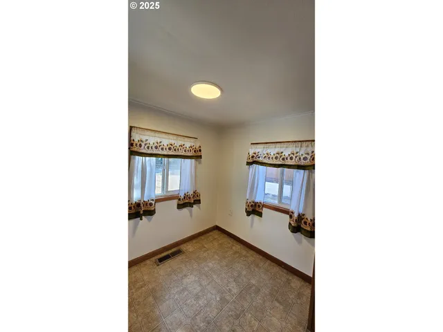 a kitchen with a stove a refrigerator and a sink