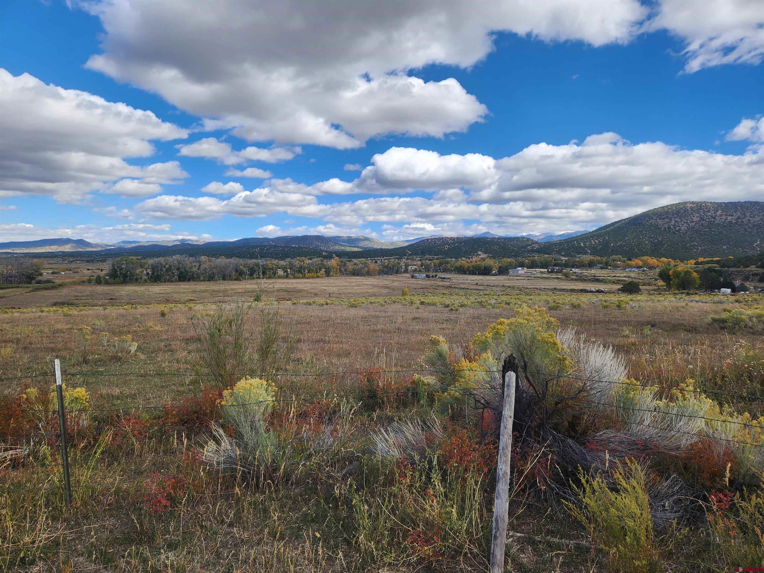 23227 County Road J.2 San Luis, CO 81152 - Photo 13 of 16 a view of a lake from a yard