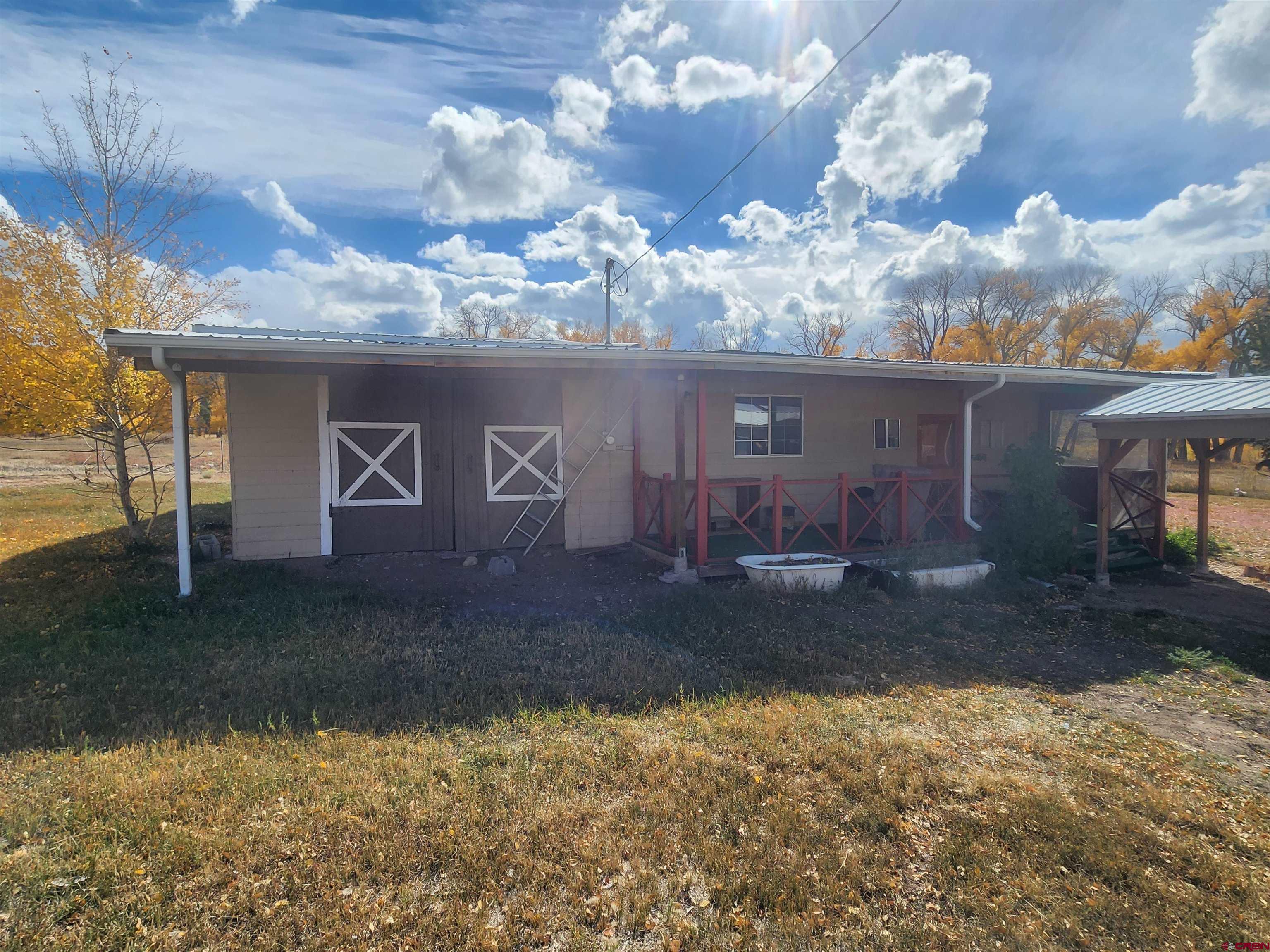 23227 County Road J.2 San Luis, CO 81152 - Photo 2 of 16 a view of a house with a yard