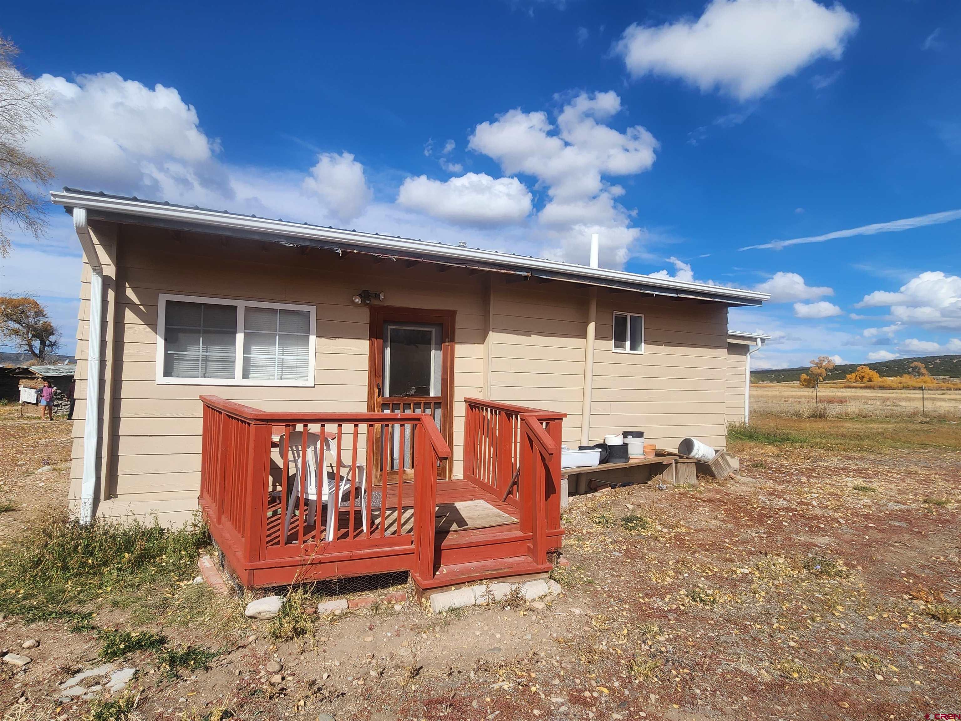 23227 County Road J.2 San Luis, CO 81152 - Photo 3 of 16 a view of a house with a yard