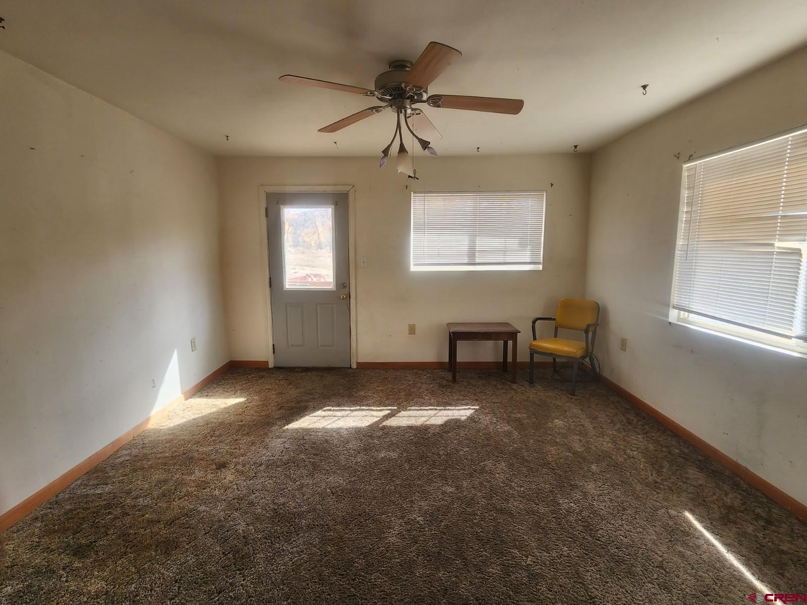 23227 County Road J.2 San Luis, CO 81152 - Photo 6 of 16 a view of a livingroom with a ceiling fan and window