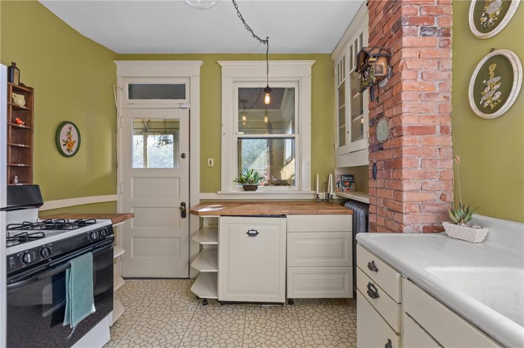 1139 Davis Avenue Pittsburgh, PA 15212 - Photo 13 of 35 a kitchen with a stove and a sink
