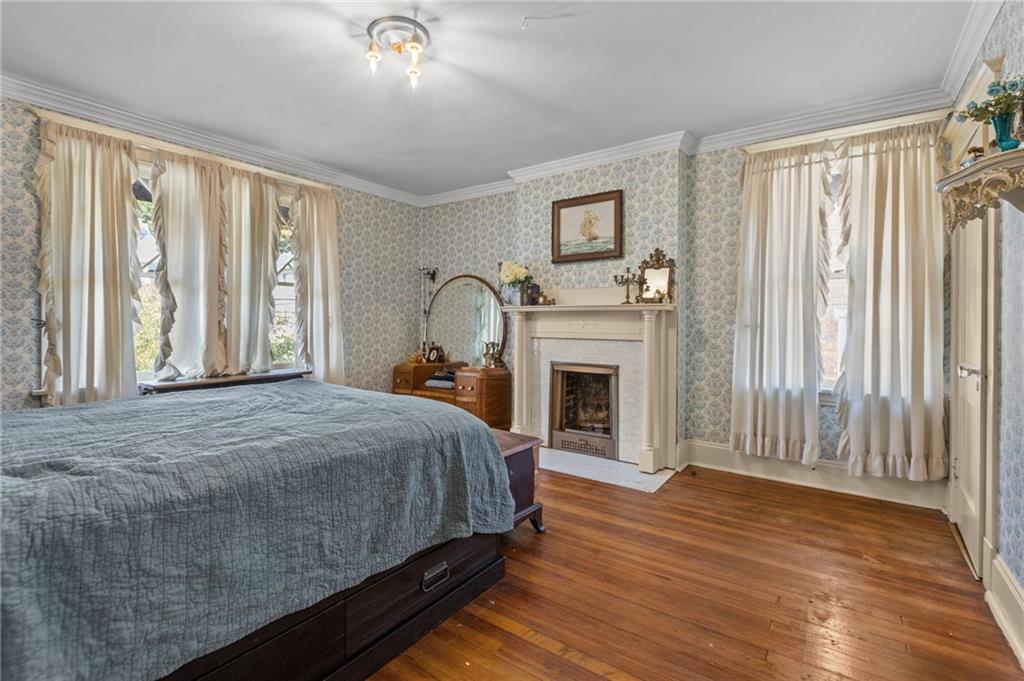 1139 Davis Avenue Pittsburgh, PA 15212 - Photo 20 of 35 a bed sitting in a spacious bedroom next to a window