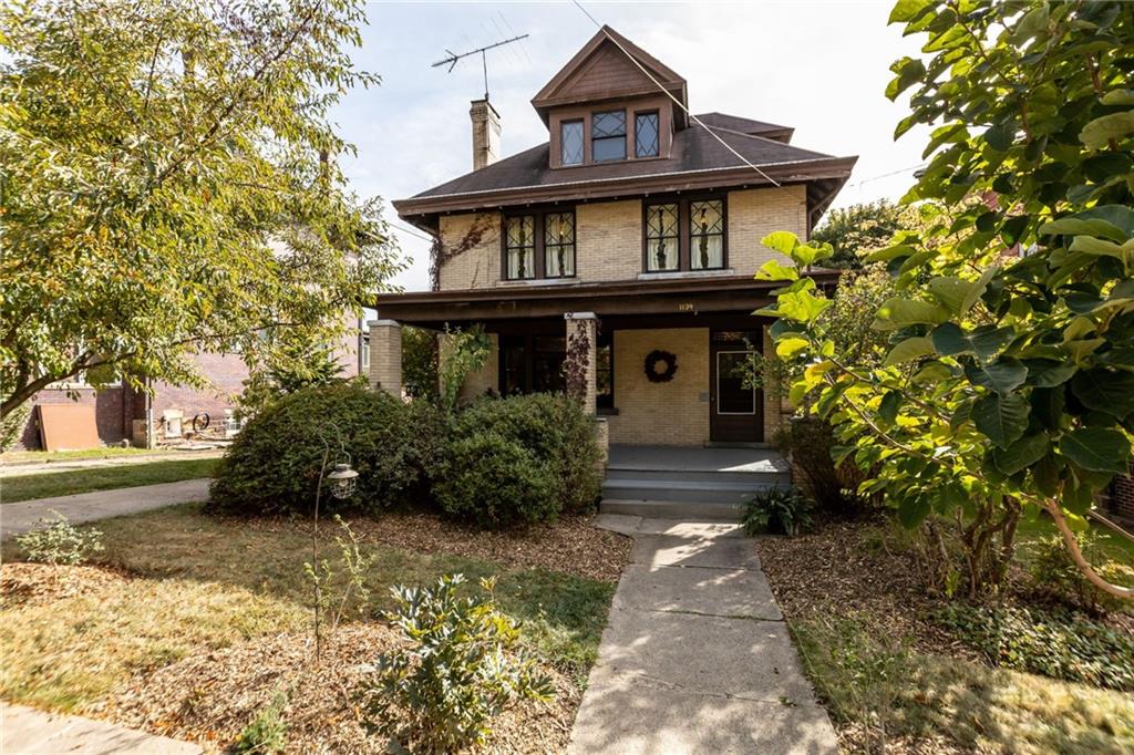 1139 Davis Avenue Pittsburgh, PA 15212 - Photo 2 of 35 a front view of a house with garden