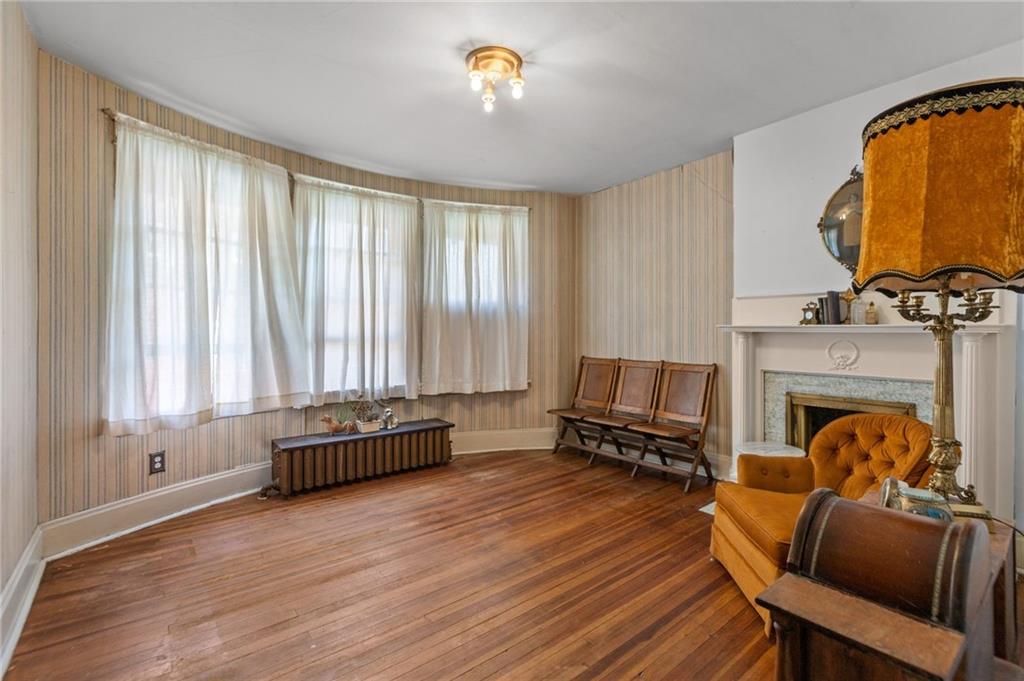 1139 Davis Avenue Pittsburgh, PA 15212 - Photo 22 of 35 a living room with furniture and a fireplace