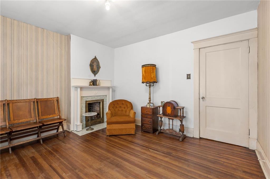 1139 Davis Avenue Pittsburgh, PA 15212 - Photo 23 of 35 a living room with furniture and a fireplace