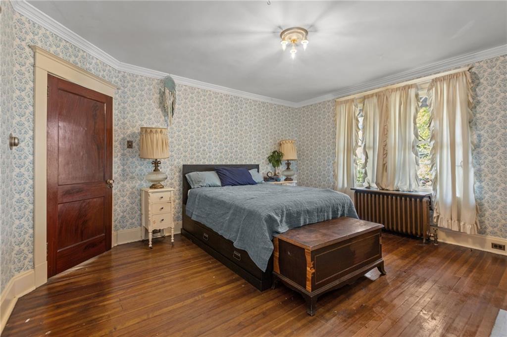 1139 Davis Avenue Pittsburgh, PA 15212 - Photo 24 of 35 a spacious bedroom with a bed and window