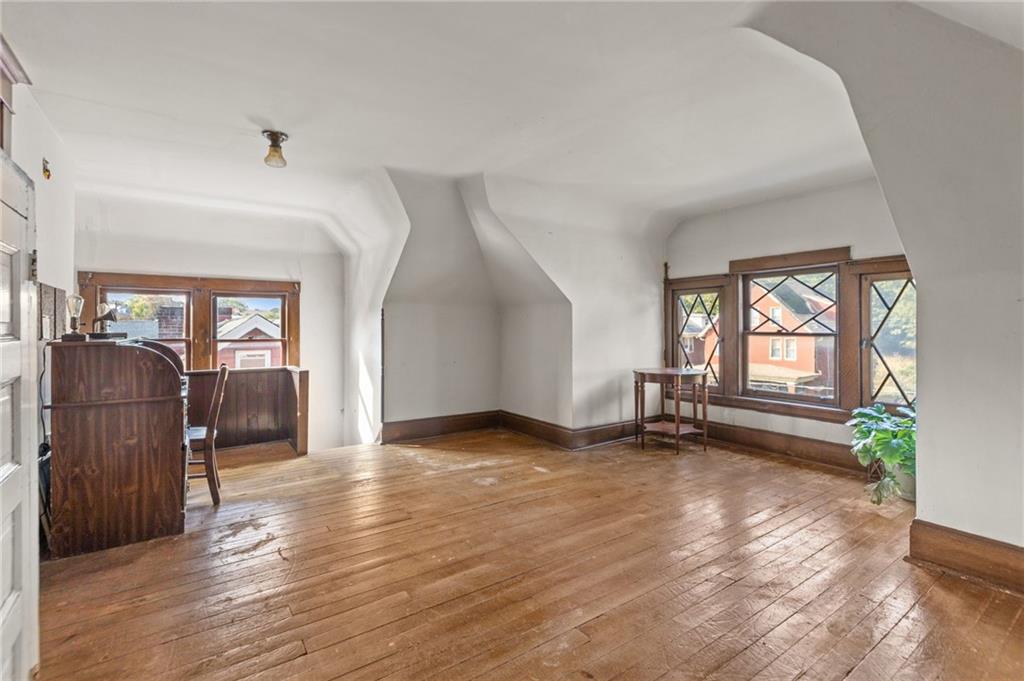 1139 Davis Avenue Pittsburgh, PA 15212 - Photo 30 of 35 wooden floor in an empty room with a window
