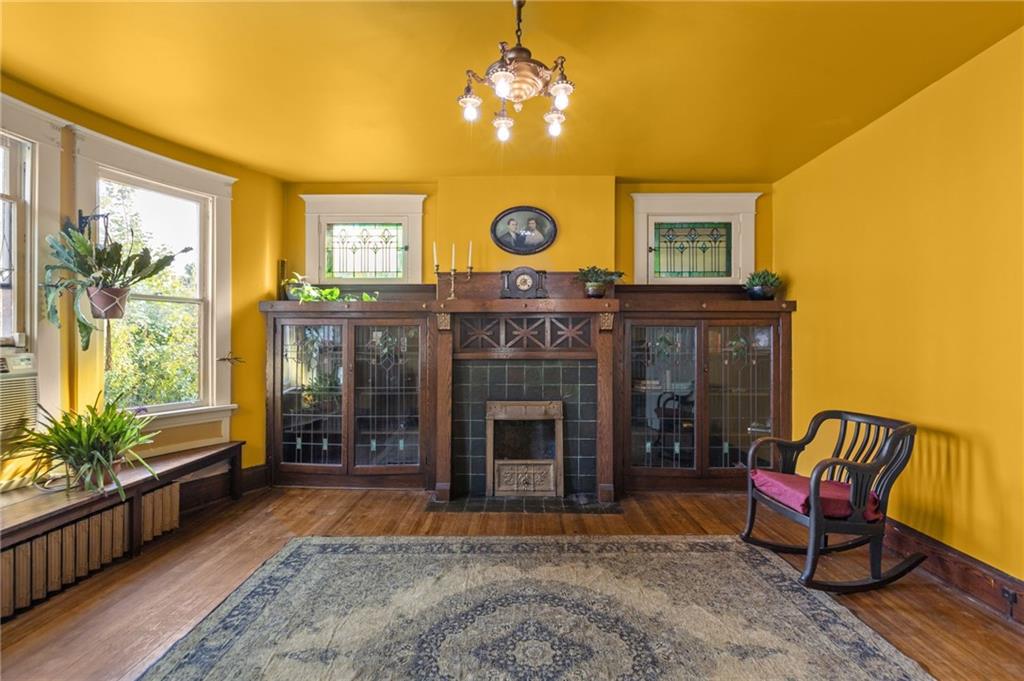 1139 Davis Avenue Pittsburgh, PA 15212 - Photo 10 of 35 a living room with furniture and a fireplace