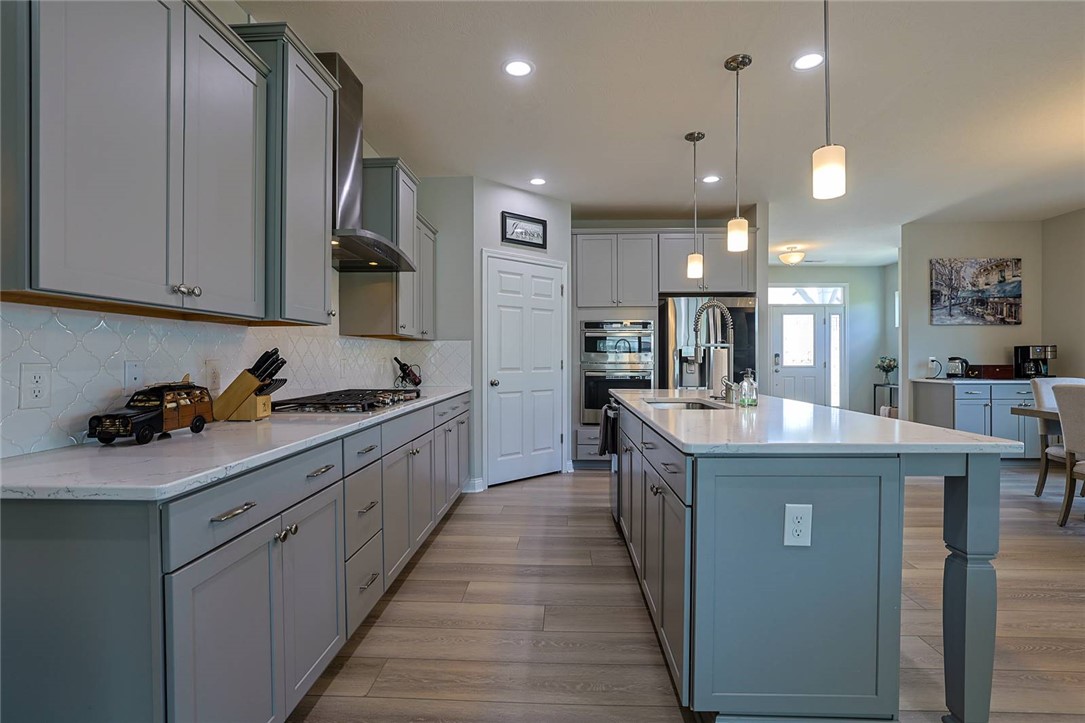 5013 Arena Court Hamilton, OH 45011 - Photo 12 of 41 This kitchen features sleek cabinetry and an inviting island, perfect for culinary endeavors and gatherings.