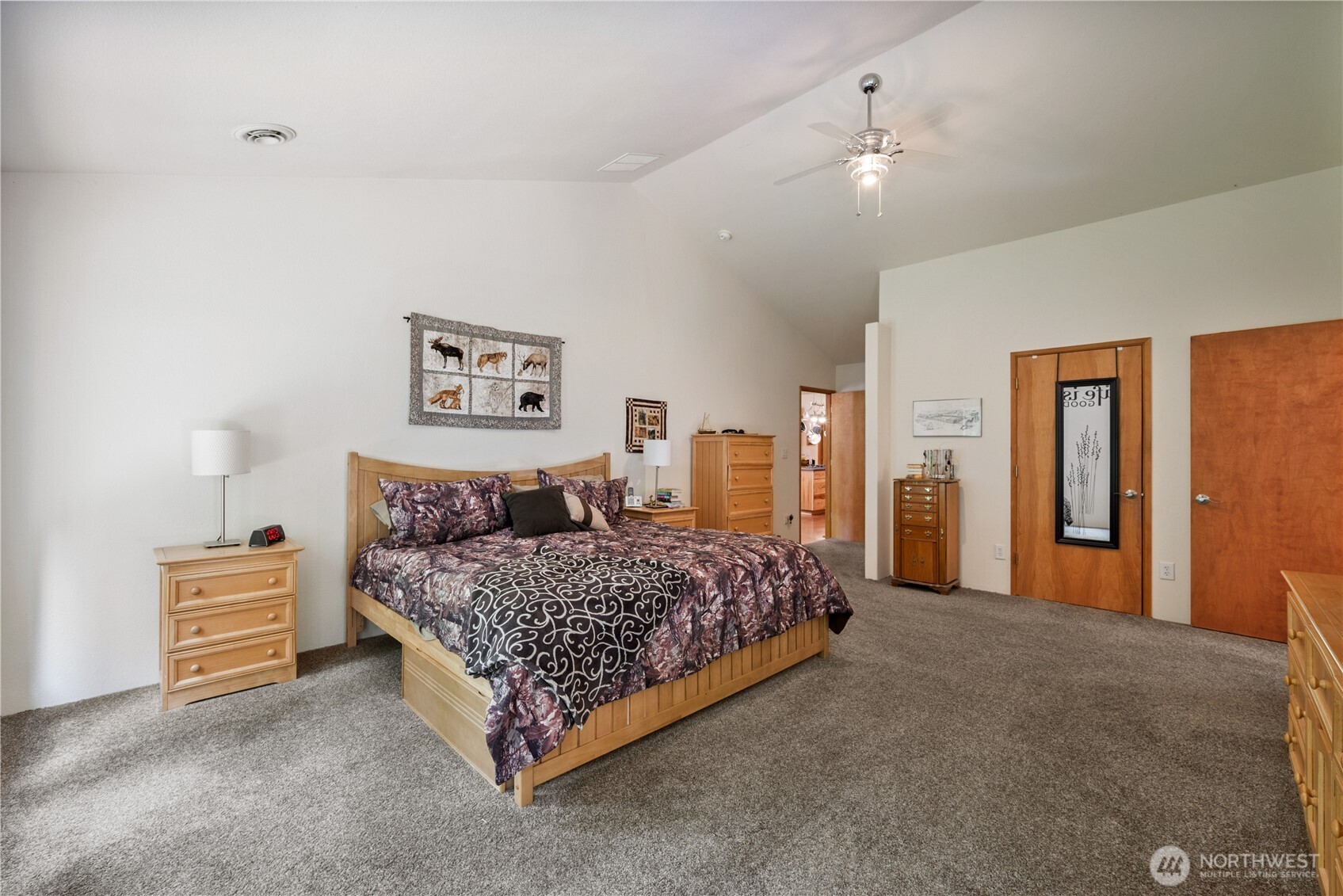 1975 Coal Creek Road Longview, WA 98632 - Photo 20 of 35 a bedroom with a bed lamp and bathroom view