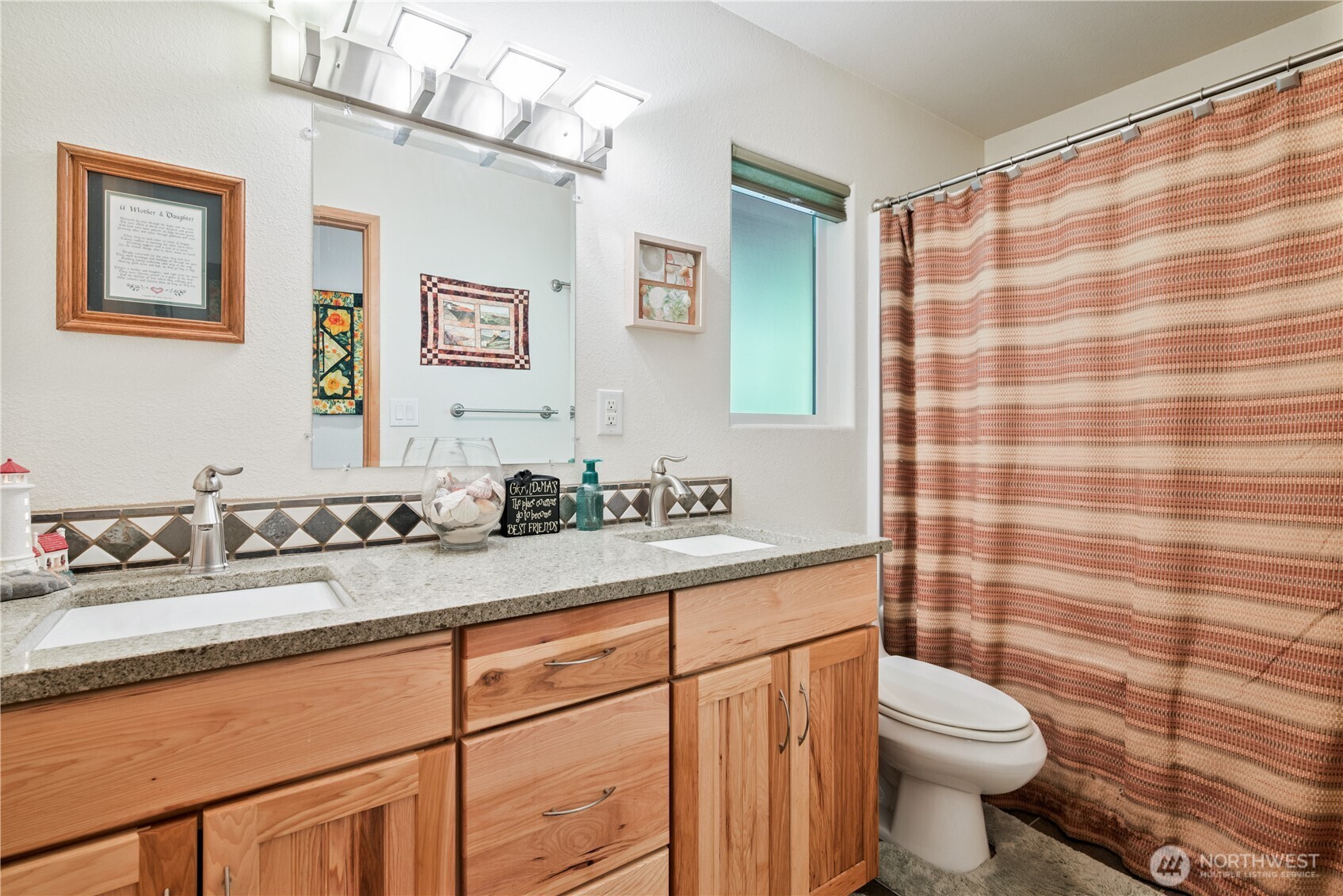 1975 Coal Creek Road Longview, WA 98632 - Photo 21 of 35 a bathroom with a granite countertop sink mirror vanity and toilet