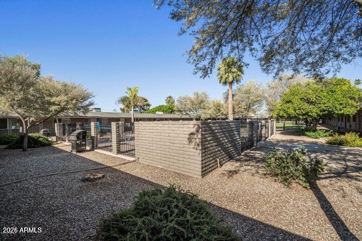 6819 North 12th Street, Unit 2 Phoenix, AZ 85014 - Photo 16 of 17 a view of a house with a tree in the background