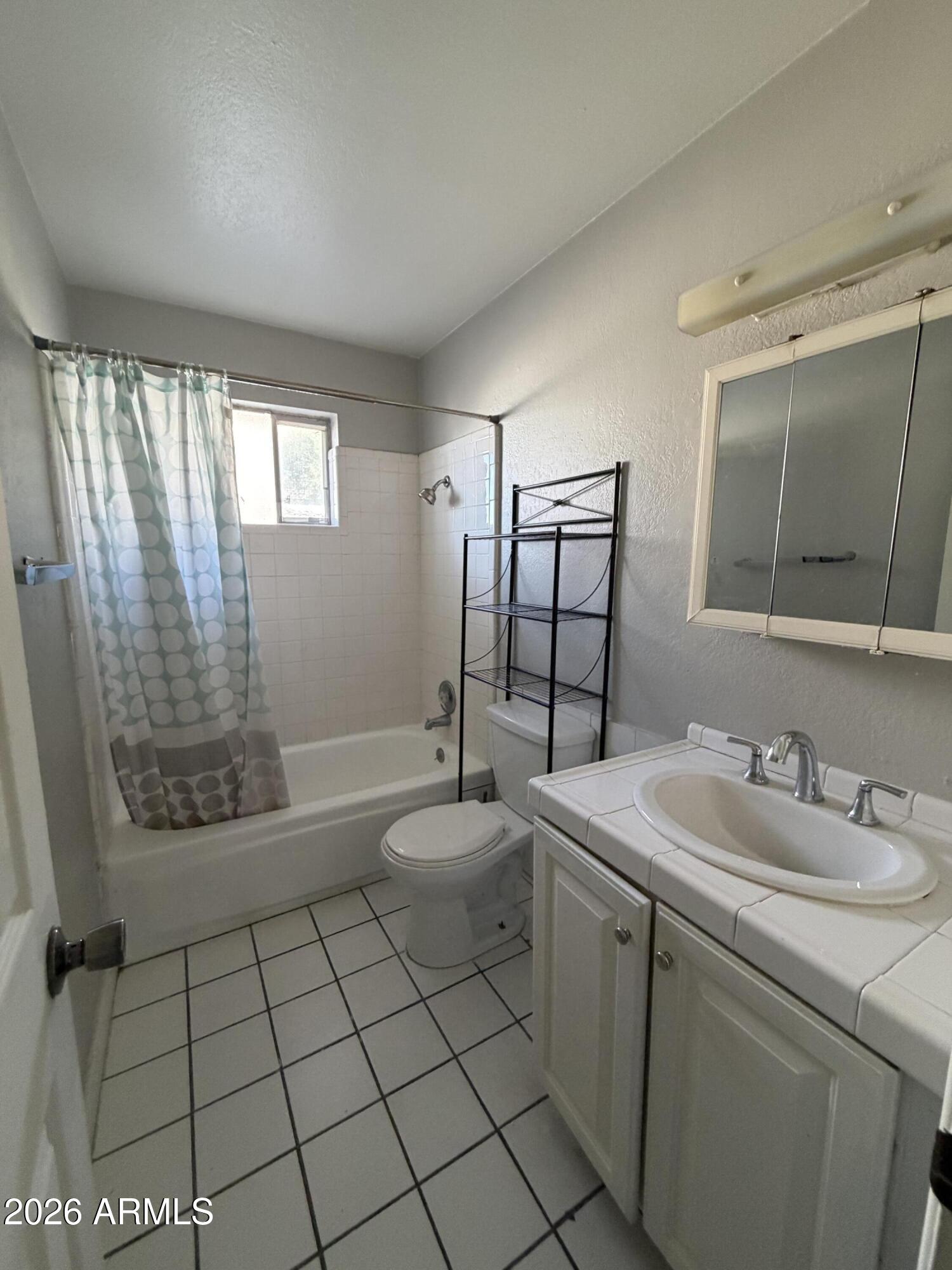 6819 North 12th Street, Unit 2 Phoenix, AZ 85014 - Photo 7 of 17 a spacious bathroom with a sink toilet and shower