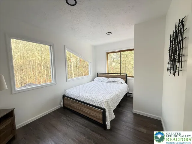 a bathroom with a sink mirror vanity and toilet