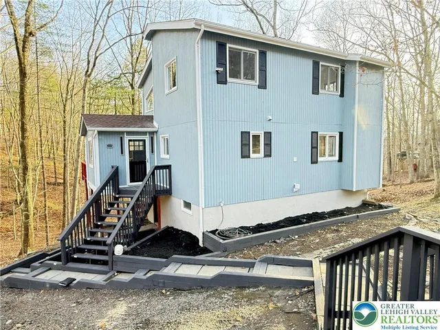 a open kitchen with sink cabinets and wooden floor