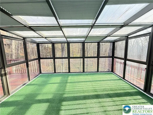 a view of a backyard with chairs