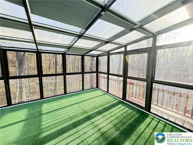 a view of a floor to ceiling window and an outdoor view