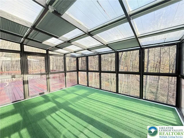 a view of a swimming pool with a yard