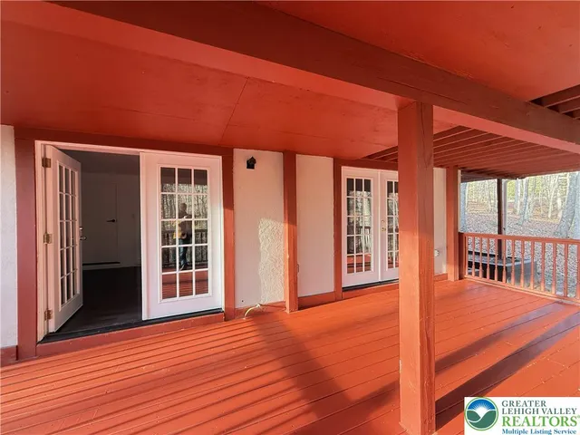 a room with lots of furniture and a large window