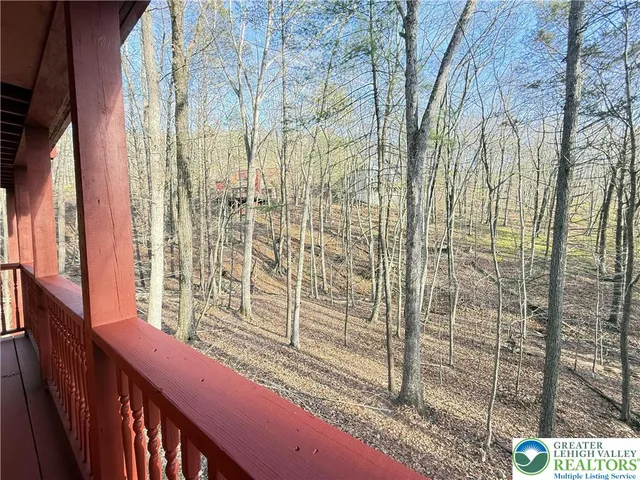 an outdoor space with furniture and garden view