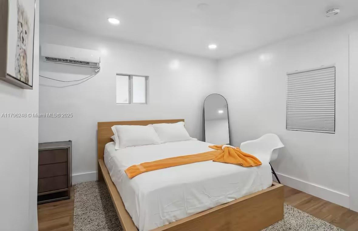 310 Oregon Street, Unit 3 Hollywood, FL 33019 - Photo 14 of 17 a bedroom with a bed and a dresser