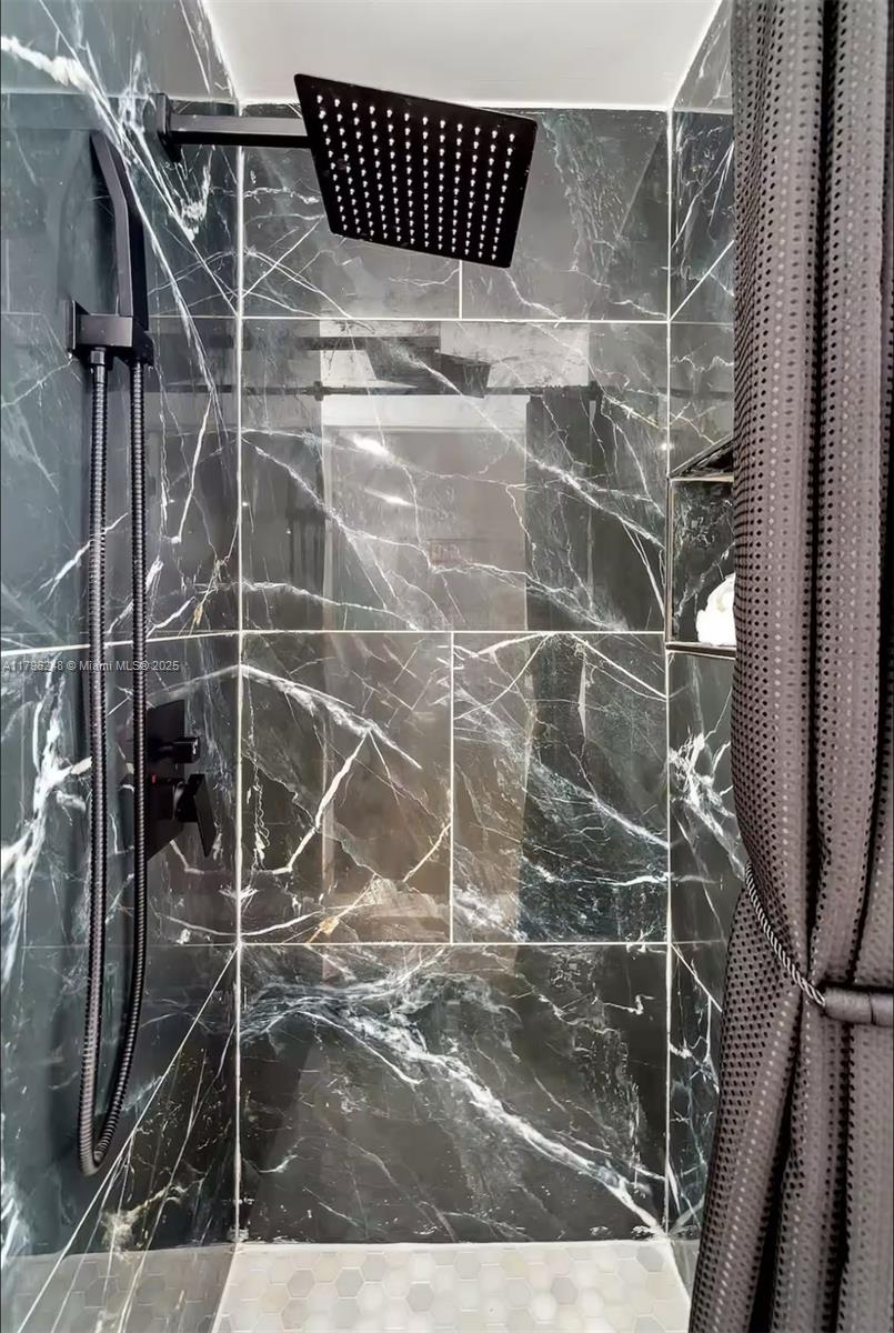 310 Oregon Street, Unit 3 Hollywood, FL 33019 - Photo 16 of 17 a bathroom with a shower