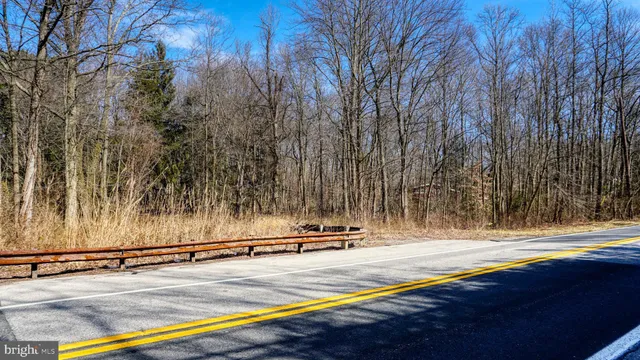 a view of swimming pool with a yard