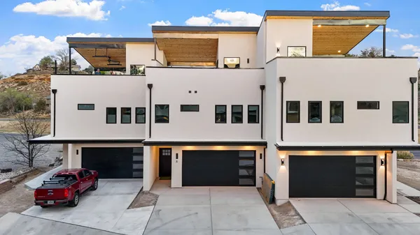 a front view of a building with parking space