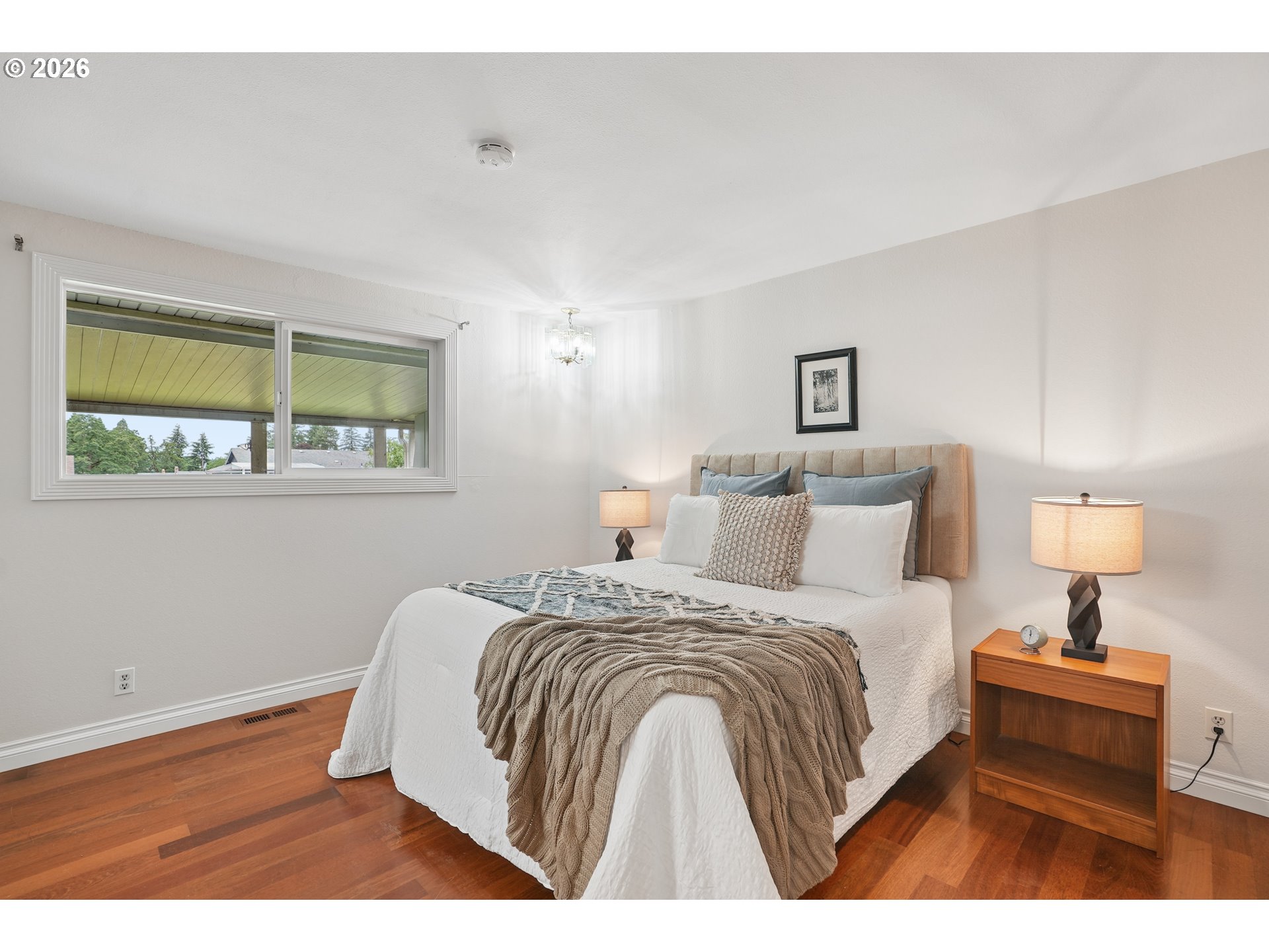 992 South South End Road Oregon City, OR 97045 - Photo 17 of 38 a bedroom with a bed and a night stand