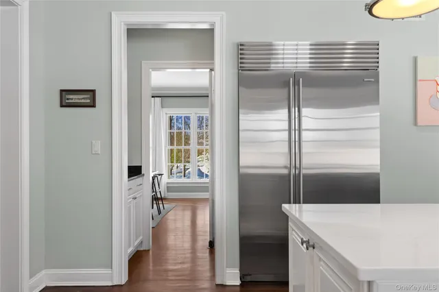 a room with a wooden floor and furniture